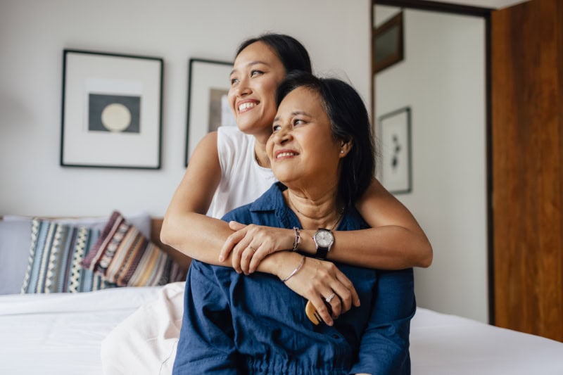 What Are Zone Control Systems? The love between a mother and daughter is forever: a smiling Asian female embracing her mother while they are looking away.